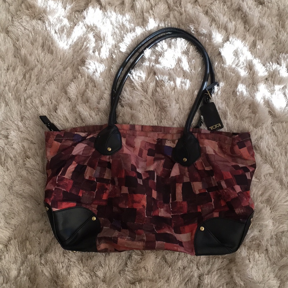 Lightly used Tumi multi colored tote